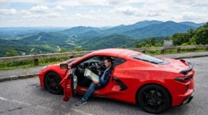 American sports car parked at a scenic road trip overlook